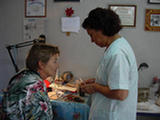 Graciela Gallegos gives Valice a lesson in line painting